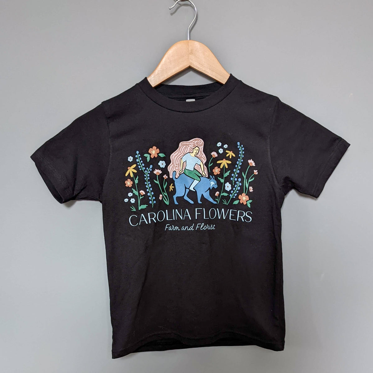 Kids Black T-Shirt with Carolina Flowers Logo